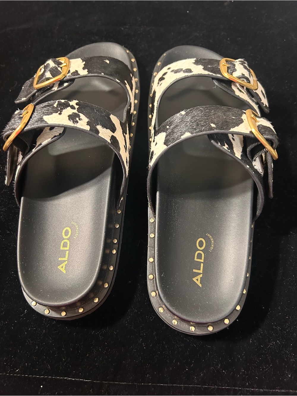 Aldo Black & White Cowhide Buckle Slide Sandals with Gold Accents